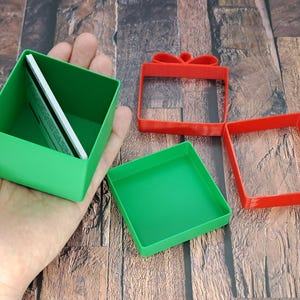 christmas gift card holder held by hand and opened to show gift cards inside