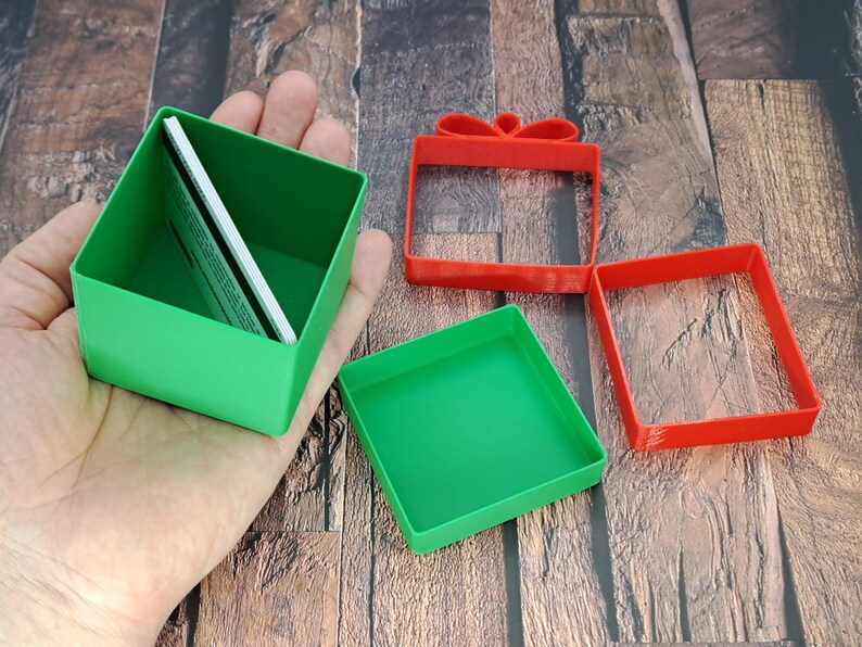 christmas gift card holder held by hand and opened to show gift cards inside