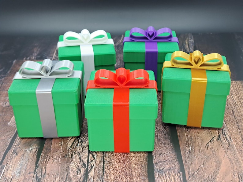 gift card holder boxes shown in green with silver, red, gold, white and purple ribbons