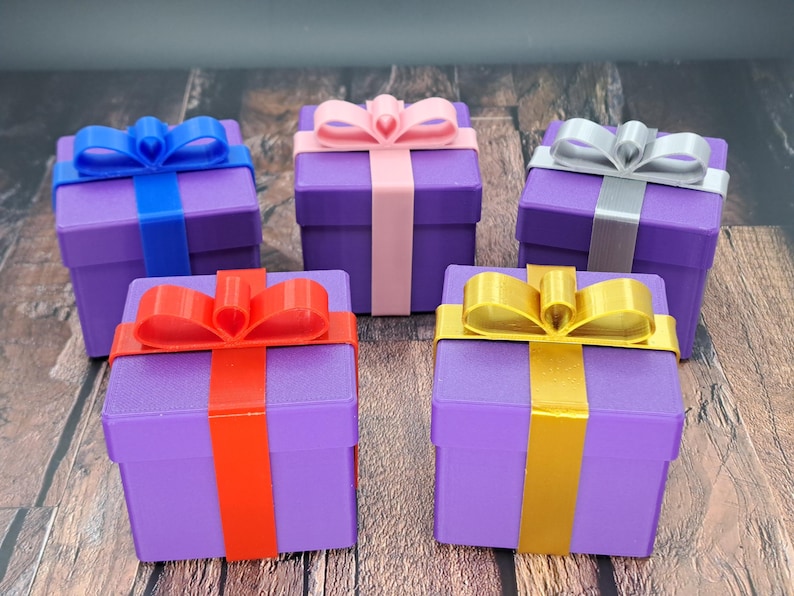 gift card gift box shown in purple with blue, red, pink, gold and silver ribbons