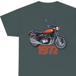 May include: A dark green t-shirt with a vintage motorcycle graphic and the text "1972" in orange.