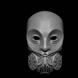 Op de afbeelding: Een grijs, gedetailleerd, 3D-geprint masker met een gezicht-achtig ontwerp en een steampunk-geïnspireerd gasmasker.