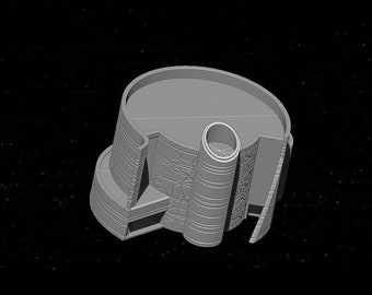May include: A gray 3D printed model of a futuristic building with a circular roof and a cylindrical tower. The building has a detailed exterior with geometric patterns.