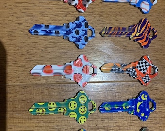 One Jet color house key blank SC1 AXXESS 68 chose from soccer, hearts, happy face, hockey pucks, baseballs ect.
