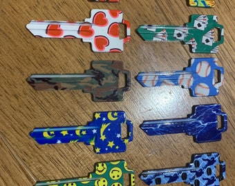 one Jet color house key blank WR5 AXXESS 67 chose from baseball, pucks, camo, sunflour, flame ect.