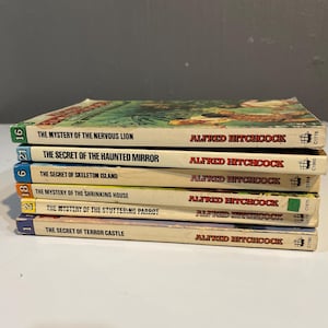One “The Three Investigators” Mystery book by Alfred Hitchcock series “you pick”