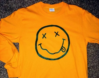 90's Retro Nirvana Smiley Face Seattle Supersonics grunge era inspired deep green ink logo screen printed on gold long sleeve t-shirt