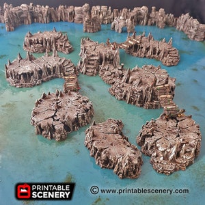 May include: A set of 3D printed, rocky islands with wooden bridges connecting them. The islands are painted in a brown and grey colour scheme, and the water is a light blue. The islands are designed for use in tabletop games.