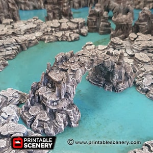 May include: A 3D printed stone bridge model for tabletop gaming. The bridge is made of grey and brown plastic and has a realistic texture. The bridge is arched and has a small opening in the centre. The bridge is sitting on a blue surface.