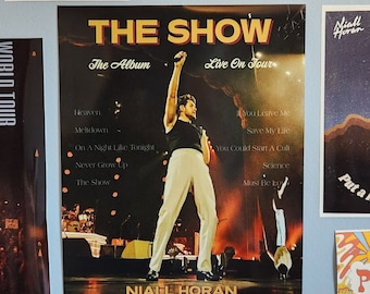 May include: A collection of posters and notes on a light blue wall. The central poster promotes "The Show" album and tour by Niall Horan. Other images include concert photos and a vinyl record care guide.