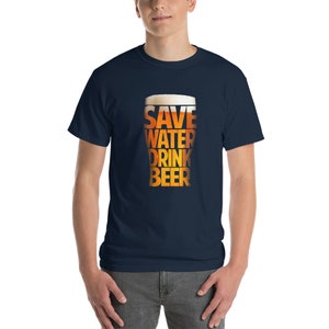 May include: A navy blue t-shirt with a graphic of a beer glass that reads "Save Water Drink Beer".