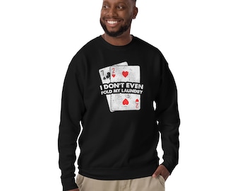 May include: Black sweatshirt with a white graphic of two playing cards and the text "I don't even fold my laundry".