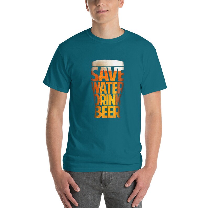 May include: A teal blue t-shirt with the text "Save Water Drink Beer" printed on the front. The text is stylized to look like a glass of beer.