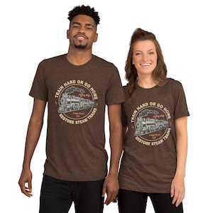 May include: Two brown t-shirts with a vintage train graphic and the text "Train Hard or Go Home. Restore Steam Trains."