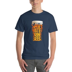 May include: A navy blue t-shirt with a graphic of a beer glass that says "Save Water Drink Beer".