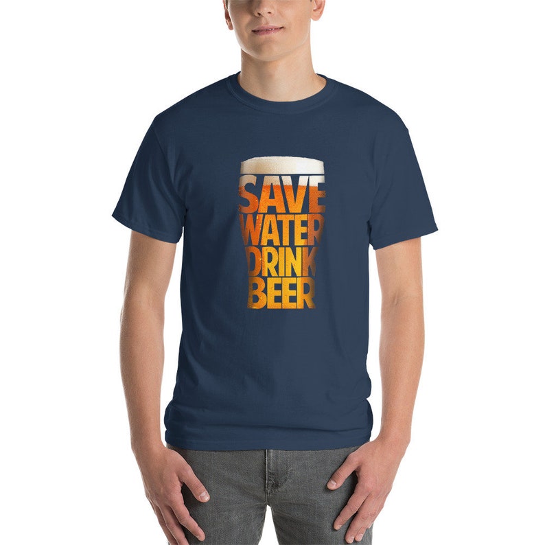 May include: A navy blue t-shirt with a graphic of a beer glass that says "Save Water Drink Beer".