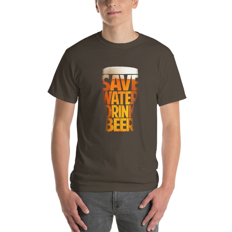 May include: A brown t-shirt with a graphic of a beer glass that says "Save Water Drink Beer".