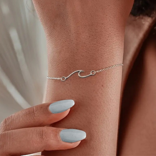 Dainty Wave Bracelet- Elegant Silver colored with Ocean wave charm.