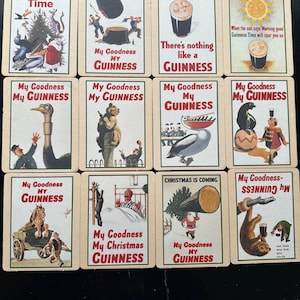 Puede incluir: Un conjunto de tarjetas publicitarias vintage de Guinness. Cada tarjeta presenta ilustraciones coloridas y las frases "Guinness Time", "My Goodness My Guinness" y "There's nothing like a Guinness". Las tarjetas muestran diversas escenas y personajes.