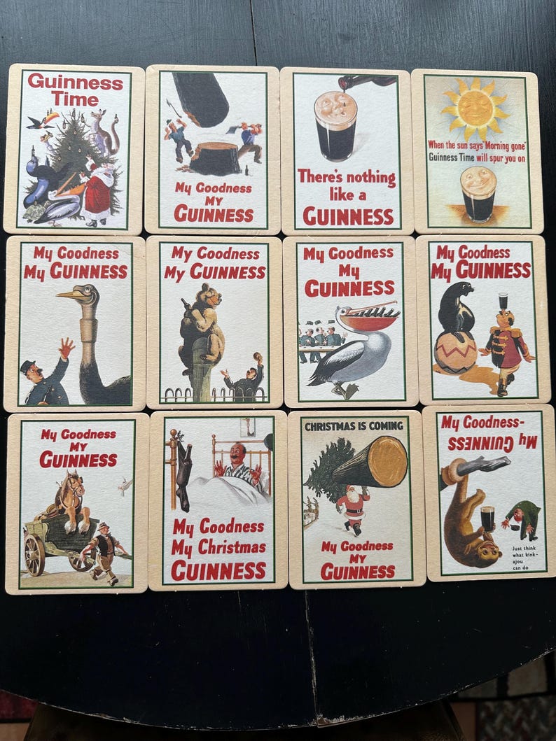 Puede incluir: Un conjunto de tarjetas publicitarias vintage de Guinness. Cada tarjeta presenta ilustraciones coloridas y las frases "Guinness Time", "My Goodness My Guinness" y "There's nothing like a Guinness". Las tarjetas muestran diversas escenas y personajes.