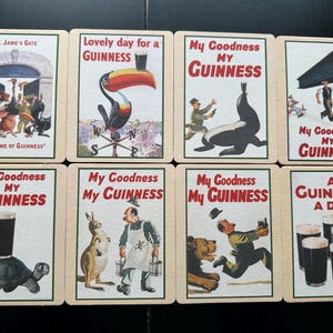 Puede incluir: Una colecci&oacute;n de tarjetas publicitarias vintage de Guinness. Cada tarjeta presenta ilustraciones coloridas y el logotipo de Guinness. Las tarjetas representan varias escenas, incluyendo animales, personas y pintas de Guinness.