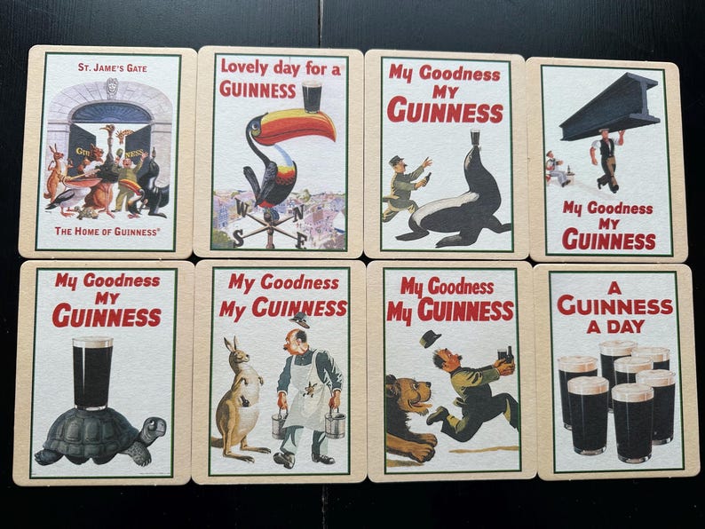 Puede incluir: Una colecci&oacute;n de tarjetas publicitarias vintage de Guinness. Cada tarjeta presenta ilustraciones coloridas y el logotipo de Guinness. Las tarjetas representan varias escenas, incluyendo animales, personas y pintas de Guinness.