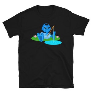 May include: A black t-shirt with a blue robot character fishing on a lily pad. The robot is wearing a blue helmet and holding a fishing rod.
