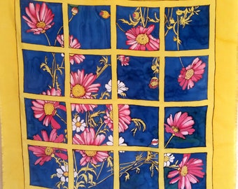 Vintage HAPPY FLOWERS French Silk Scarf as seen through a window or trellis against a bright blue sky.