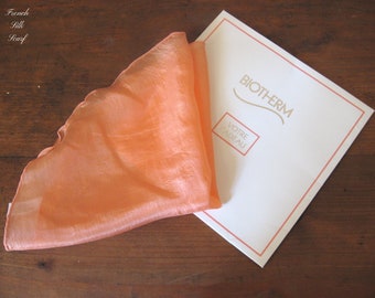 1960s FRENCH SILK HANDKERCHIEF in its original vintage packaging, by Biotherm, oval shape with fluted edge.