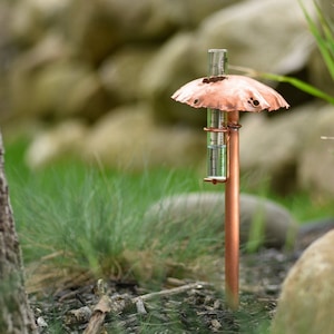 Rain gauge with one single glass tube option.