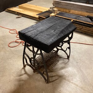 Charred maple top paired with vintage sewing machine base