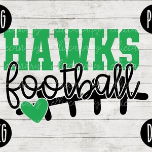 May include: Green and black graphic design with the text "HAWKS FOOTBALL" and a green heart. The design is on a white wood background.