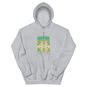 May include: A gray hoodie with a graphic of the Eiffel Tower and the text "CHAMP DE MARS PARIS, FRANCE".