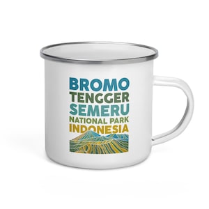 May include: White enamel camping mug with a colorful graphic of a mountain range and the text "Bromo Tengger Semeru National Park Indonesia".