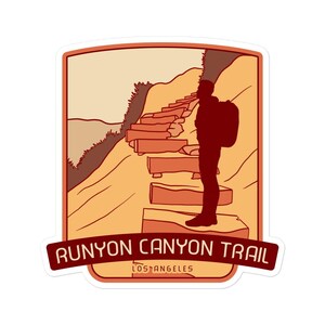 May include: A sticker featuring a silhouette of a hiker on the Runyon Canyon Trail in Los Angeles, California. The sticker is in a retro style with a red, orange, and yellow colour scheme.