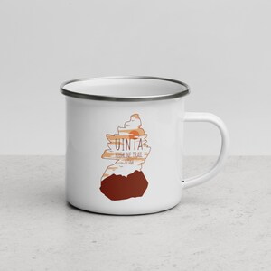 May include: White enamel mug with a graphic of a mountain range and the text "Uinta Highline Trail Utah".