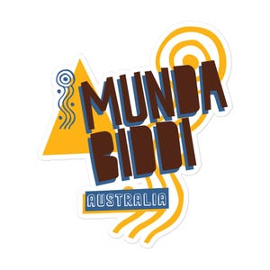 May include: A sticker with the words "Munda Biddi" in brown, outlined in blue, with a yellow triangle and swirls. The word "Australia" is in a blue rectangle at the bottom. The design has a retro, travel-themed aesthetic.