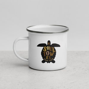 May include: White enamel camping mug with a black silhouette of a sea turtle. The turtle's shell is filled with the words "Sheltowee Trace Road" in brown and gold lettering.