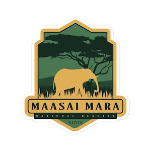 May include: A green and gold sticker with an elephant silhouette and the text "Maasai Mara National Reserve Kenya".