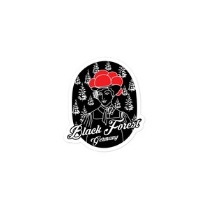 May include: Black and white illustration of a woman wearing a red hat with a black forest background. The text "Black Forest Germany" is written below the woman.