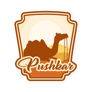 May include: A sticker featuring a brown camel silhouette against a desert landscape with a setting sun. The word "Pushkar" is written in a stylized script below the camel, all within a decorative frame.