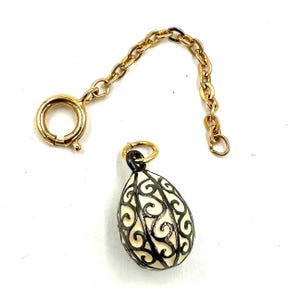 Vintage JOAN RIVERS EGG Charm Pendant Gold White Enamel Scroll Pattern Collectable faberge style Eggs