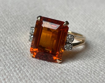 A 14 karat gold citrine and diamond vintage ring