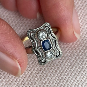 An 18 karat gold and platinum diamond and sapphire ring