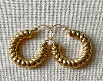 A pair of 18 karat gold vintage hoops
