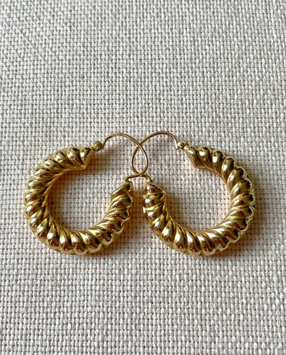 A pair of 18 karat gold vintage hoops