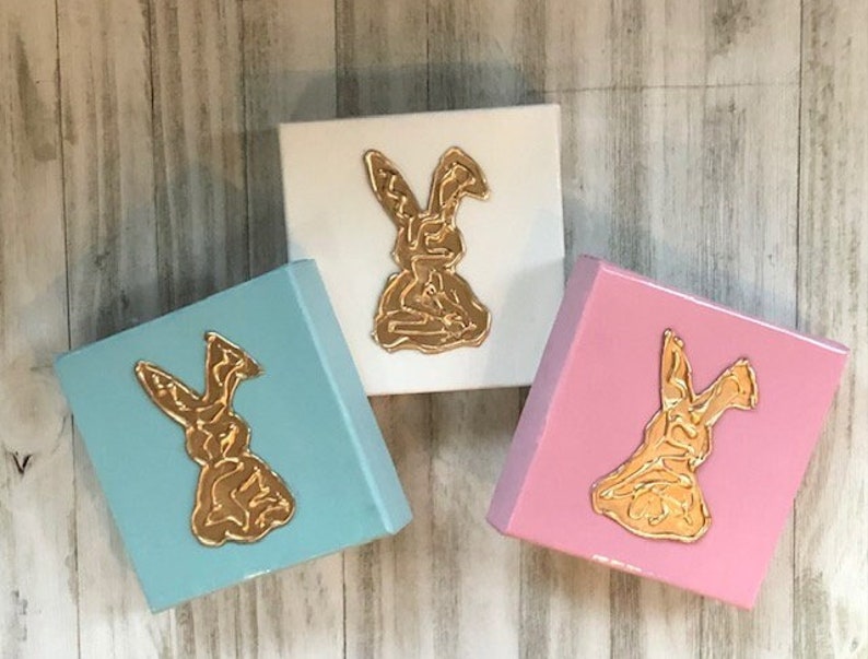 Small resin, pastel canvas featuring a gold textured Easter Bunny image. The canvas measures 6x6" and can be ordered in white, blue, pink or color of your choice.