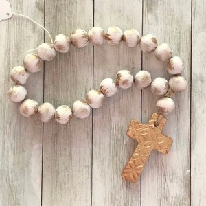 White Wood Bead Garland with Gold Cross: Coffee Table Decor