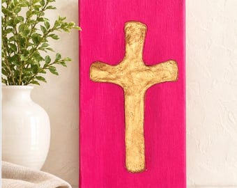 Gold Clay Cross on Hot Pink Canvas: Hand-Sculpted Wall Art