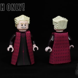May include: A LEGO minifigure wearing a red and black patterned robe with a black undergarment. The minifigure has blonde hair and a stern expression. The text "CLOTH ONLY!" is visible at the top of the image.